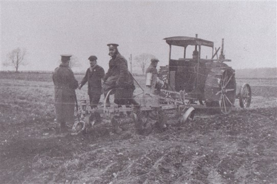 Photo:Above & below: An early tractor in use at Black Hills farm at Edwinstowe.  Soldiers in uniform are seen assisting operations