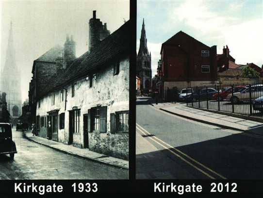 Photo:Our photo (right) shows that a used car lot has replaced the old cottages from 1933.